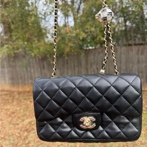 CHANEL Black Quilted Crossbody with Gold Accents